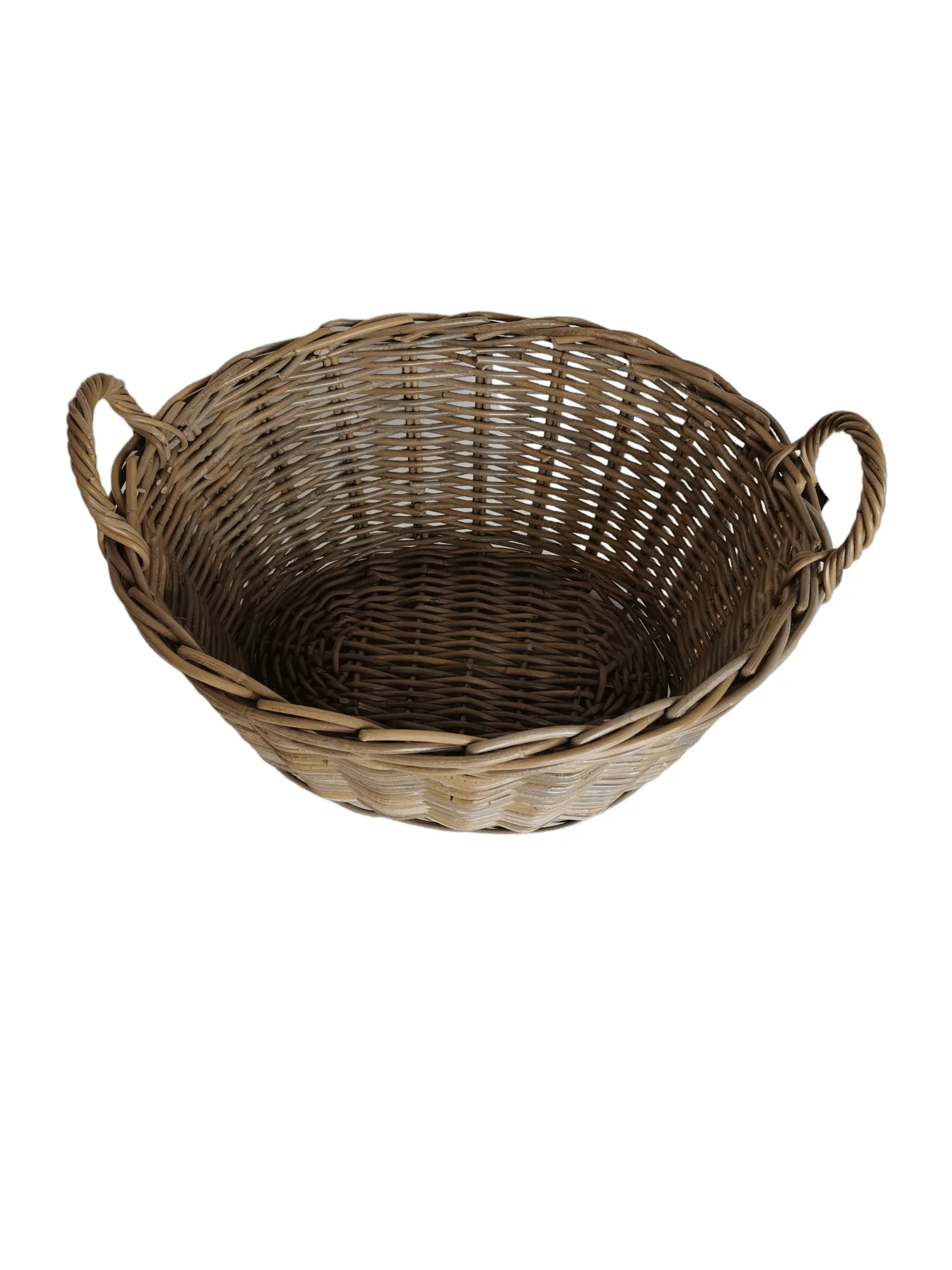 Oval shaped wicker log basket with eared handles.